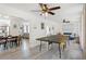 Open-concept living space with a game room, dining area, and comfortable seating at 6442 Colonial Dr, Sarasota, FL 34231