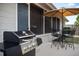 Outdoor patio with grill and seating area, perfect for entertaining at 6442 Colonial Dr, Sarasota, FL 34231