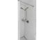 Tiled shower stall with handheld shower head and built-in shelving at 6442 Colonial Dr, Sarasota, FL 34231