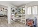 Well-organized storage area with ample shelving and backyard access at 6442 Colonial Dr, Sarasota, FL 34231