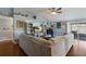 Bright living room with a large sectional couch and sliding glass doors to the outdoor patio at 6503 32Nd W Ave, Bradenton, FL 34209