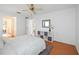 Bright bedroom with a queen bed and a view into the hallway with a closet at 6675 Easton Dr, Sarasota, FL 34238