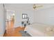 Bright bedroom with a queen bed and a view into the hallway with a closet at 6675 Easton Dr, Sarasota, FL 34238
