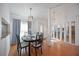 Open dining area with stylish decor, hardwood floors, and modern lighting at 6675 Easton Dr, Sarasota, FL 34238