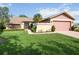 Charming home with a well-manicured lawn and a quaint front entrance at 6675 Easton Dr, Sarasota, FL 34238