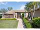 Charming home with a welcoming front entrance and beautiful landscaping at 6675 Easton Dr, Sarasota, FL 34238