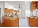 Bright kitchen featuring granite countertops, ample cabinetry, and white appliances, offering a functional layout at 6675 Easton Dr, Sarasota, FL 34238