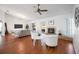Bright living room featuring hardwood floors, a fireplace, and comfortable seating at 6675 Easton Dr, Sarasota, FL 34238