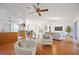 Spacious living area showcasing an open layout, wood floors and modern design at 6675 Easton Dr, Sarasota, FL 34238