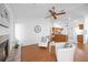 Cozy living area with a fireplace, hardwood floors, and plenty of natural light at 6675 Easton Dr, Sarasota, FL 34238