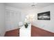 Bright office space with a ceiling fan, a closet with white doors and a modern white desk at 6675 Easton Dr, Sarasota, FL 34238