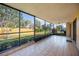 Expansive screened-in patio offering an abundance of space and natural light, perfect for outdoor living at 6675 Easton Dr, Sarasota, FL 34238
