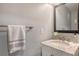Bathroom features a marble vanity, modern fixtures, and a decorative mirror at 6836 Midnight Pass Rd # 6836, Sarasota, FL 34242
