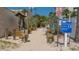 Beach access entrance with wooden posts, signage, and a sandy path leading to Siesta Beach at 6836 Midnight Pass Rd # 6836, Sarasota, FL 34242