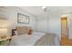 Bright bedroom with a closet, artwork, wood floors and an ensuite bathroom at 6836 Midnight Pass Rd # 6836, Sarasota, FL 34242
