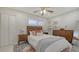 Cozy bedroom boasts a comfortable bed, stylish decor, and ample natural light at 6836 Midnight Pass Rd # 6836, Sarasota, FL 34242