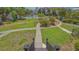 A well-maintained community area with lush greenery, a pool, and a charming building in the background at 6836 Midnight Pass Rd # 6836, Sarasota, FL 34242