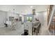 Bright kitchen boasts stainless appliances, modern white cabinetry, marble countertops, and a breakfast bar at 6836 Midnight Pass Rd # 6836, Sarasota, FL 34242