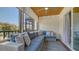 Relaxing screened-in patio featuring comfortable seating, a ceiling fan, and ample space to unwind at 6836 Midnight Pass Rd # 6836, Sarasota, FL 34242