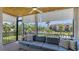 Inviting screened patio with comfortable seating, a ceiling fan, and views of the community at 6836 Midnight Pass Rd # 6836, Sarasota, FL 34242