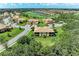 Aerial view of a building in a community with golf course and water views at 6907 Grand Estuary Trl # 104, Bradenton, FL 34212