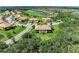 Aerial view of the property showcasing a golf course and water features at 6907 Grand Estuary Trl # 104, Bradenton, FL 34212