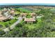 Aerial view of the property showcasing lush trees and a serene landscape at 6907 Grand Estuary Trl # 104, Bradenton, FL 34212