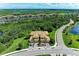 Property aerial showcasing a peaceful location surrounded by lush greenery at 6907 Grand Estuary Trl # 104, Bradenton, FL 34212