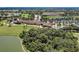 Golf course community featuring resort-style amenities including clubhouse, pool, and lush landscaping at 6907 Grand Estuary Trl # 104, Bradenton, FL 34212