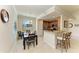 Open concept with dining room set, breakfast bar, and updated kitchen in view at 6907 Grand Estuary Trl # 104, Bradenton, FL 34212