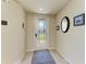 Bright entryway with a decorative glass door and tile flooring, offering a stylish welcome at 6907 Grand Estuary Trl # 104, Bradenton, FL 34212