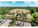 Elegant home with a red tiled roof, lush landscaping and three-car garage at 6907 Grand Estuary Trl # 104, Bradenton, FL 34212