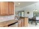 Updated kitchen featuring granite countertops open to view of dining room at 6907 Grand Estuary Trl # 104, Bradenton, FL 34212