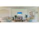 Bright living room with tile floors, a ceiling fan, and a tranquil view into the bedroom at 6907 Grand Estuary Trl # 104, Bradenton, FL 34212