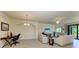 Spacious living room with tile floors, neutral tones, and lots of natural light at 6907 Grand Estuary Trl # 104, Bradenton, FL 34212