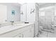 Bright bathroom with a modern vanity, a large mirror, and a glass-enclosed shower at 6909 34Th W Ave, Bradenton, FL 34209