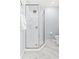 Updated bathroom featuring a glass-enclosed shower with tiled walls and a modern shower head at 6909 34Th W Ave, Bradenton, FL 34209