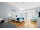 Bright bedroom featuring light blue walls, white furniture, and a sliding glass door at 6909 34Th W Ave, Bradenton, FL 34209
