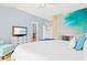 Bedroom with white walls and beach-themed mural at 6909 34Th W Ave, Bradenton, FL 34209