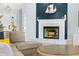 Close up of the nautical-themed fireplace with attractive hearth in the light-filled living room at 6909 34Th W Ave, Bradenton, FL 34209