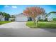 Charming home featuring well-maintained landscaping, paved driveway, and a welcoming two-car garage at 6909 34Th W Ave, Bradenton, FL 34209