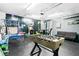 Fun game room featuring a foosball table, basketball game, and seating area at 6909 34Th W Ave, Bradenton, FL 34209