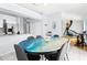 Open kitchen and eating area with a colorful custom table and an artistic mural at 6909 34Th W Ave, Bradenton, FL 34209
