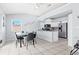 Bright kitchen features white cabinets, stainless steel appliances, and a table with chairs at 6909 34Th W Ave, Bradenton, FL 34209