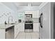 Kitchen with stainless steel appliances, white cabinetry, and a granite countertop at 6909 34Th W Ave, Bradenton, FL 34209