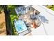 Backyard aerial view showcasing the hot tub, patio areas, and outdoor dining space perfect for entertaining guests at 708 32Nd W St, Bradenton, FL 34205