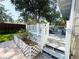 Backyard deck and landscaping featuring a patio area and decorative fencing at 708 32Nd W St, Bradenton, FL 34205