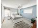 This bedroom features an accent wall, neutral carpet, and ceiling fan at 708 32Nd W St, Bradenton, FL 34205
