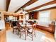 Cozy dining room with a table and chairs set on a rug, complemented by a window bench and built-in cabinets at 708 32Nd W St, Bradenton, FL 34205