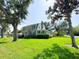 Charming two-story home with a well-maintained lawn and mature trees and shrubs at 708 32Nd W St, Bradenton, FL 34205
